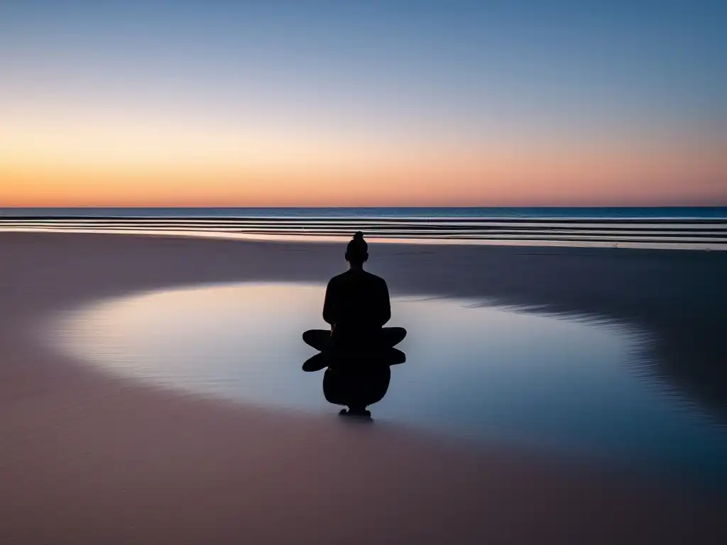 Persona meditando en una playa al atardecer, rodeada de agua tranquila y cielo despejado