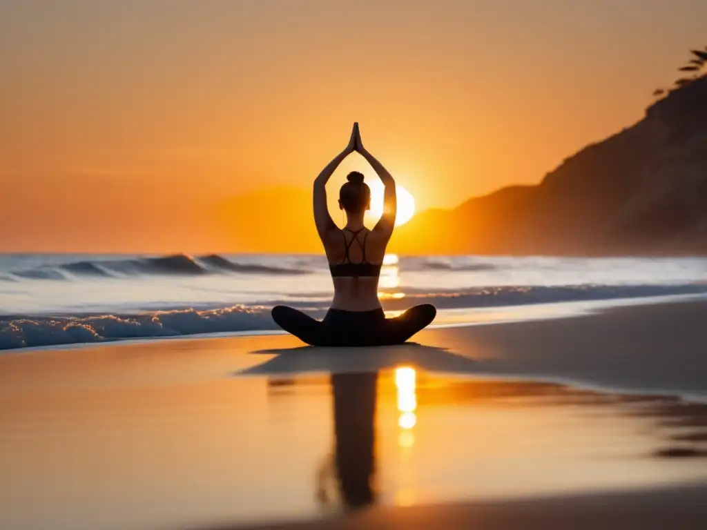 Hábitos saludables para equilibrio emocional: persona haciendo yoga en la playa al atardecer, transmitiendo serenidad y paz interior